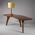 Unique-table-with-three-legs-and-a-beautiful-lamp-s