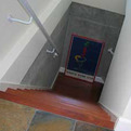 Wood-stairs-lead-to-wine-storage-cellar-s