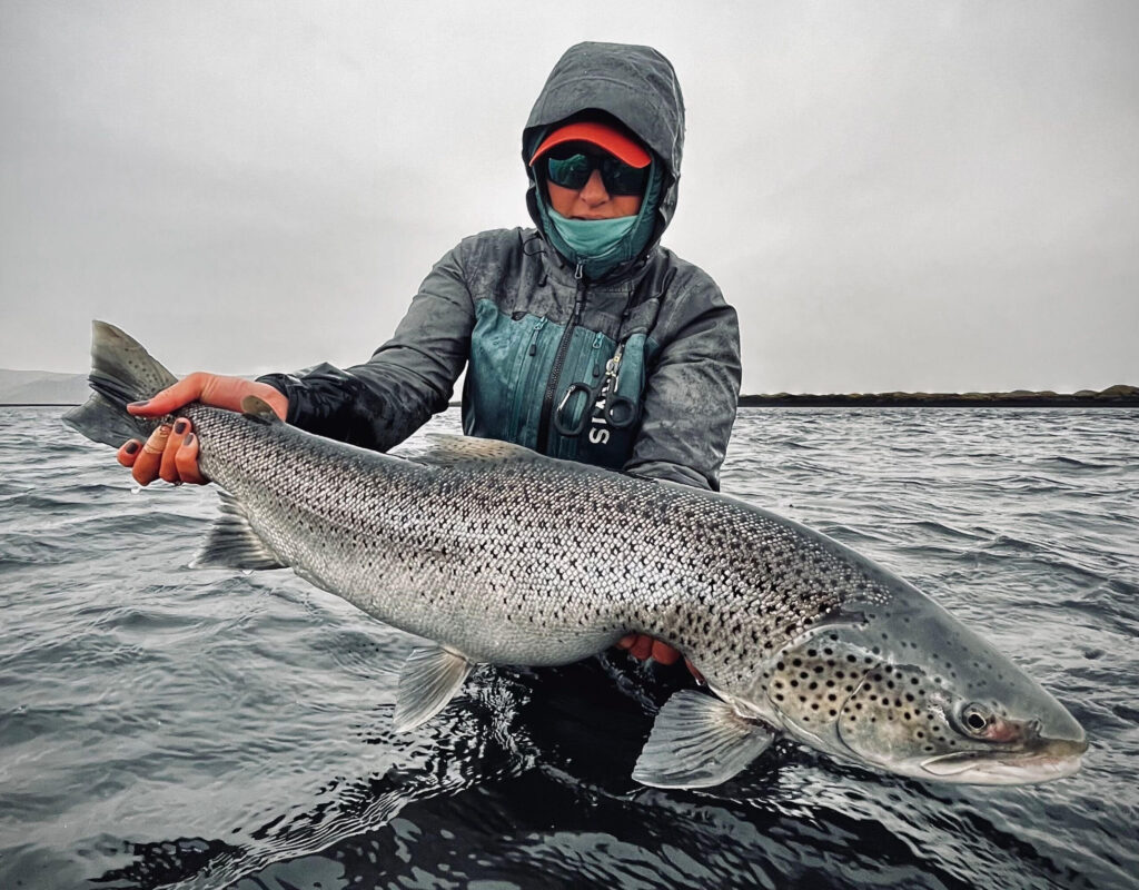Writer and photographer Jess McGlothlin in the field catching giant fish