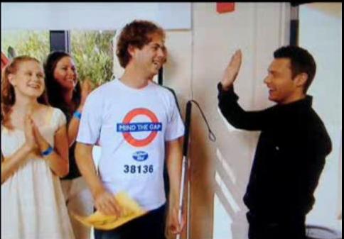 ryan seacrest high fives a blind man