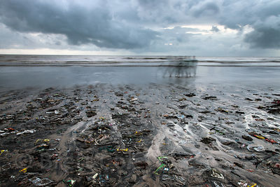 Dusk view of trash on Juhu Beach in Mumbai, India.