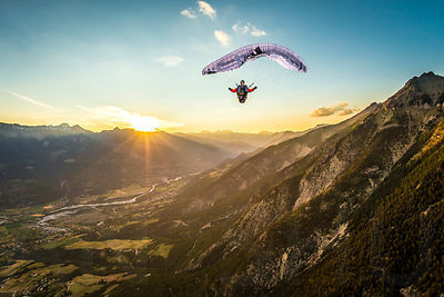 High up in the air, the Alps, a sunset and a full stall glider with Jean Baptiste Chandelier