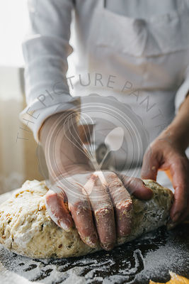 Woman Preparing Homemade Dough in the Kitchen and using a mincing machine. Preparation Raw Dough for Baking