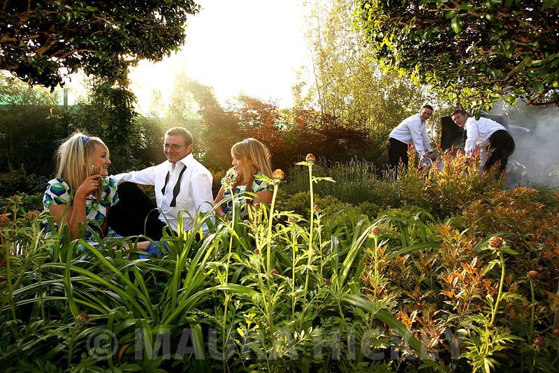 Peter Donegan's garden's silver medal winner in the large garden category with "No rubber soul" at the Bloom garden exhibition at Phoenix Park which runs from the 1st to the 4th of June..LtoR: models, Jessica and Natalie with Jean Michel Hallet, landscape manager, David Milner, landscape manager and Peter Donegan..Pic. Maura Hickey/086 8541130.