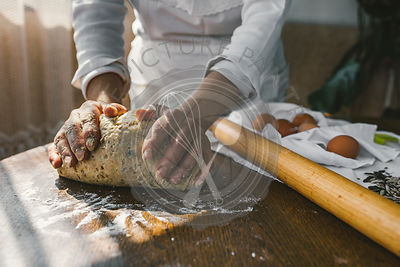 Woman Preparing Homemade Dough in the Kitchen. Preparation Raw Dough for Baking