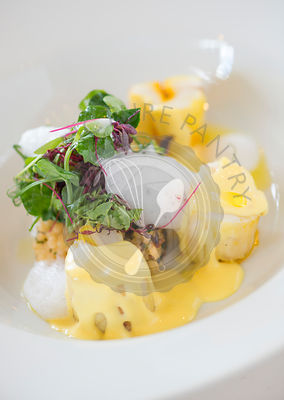 Saffron and corriander infused monkfish, cous cous, black olives and lemon foam.