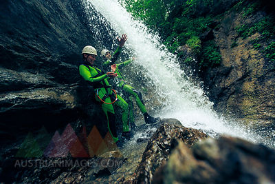 Germany, Bavaria, Allgaeu, young couple canyoning in Ostertal