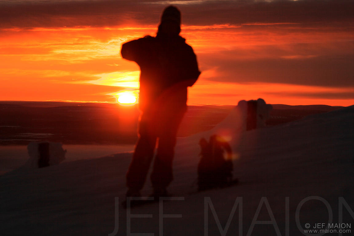 Hiker facing winter sun