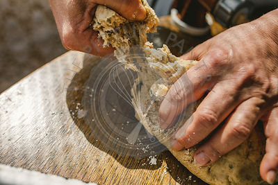 Woman Preparing Homemade Dough in the Kitchen. Preparation Raw Dough for Baking
