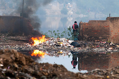 A fire burns at the Dhapa Dumping Ground, the main landfill for Kolkata, India.