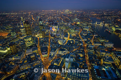 Over the City of London at dusk.