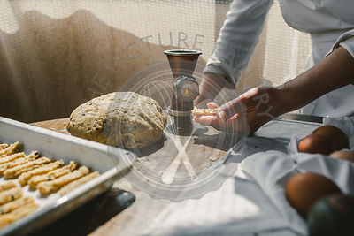 Woman Preparing Homemade Dough in the Kitchen and using a mincing machine. Preparation Raw Dough for Baking