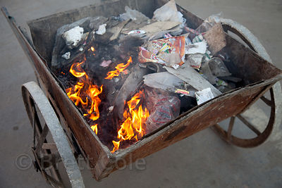 Unattended cart full of burning garbage, Jodhpur, Rajasthan, India