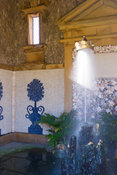 Interior of Oberon's Palace, based on a design by Inigo Jones, encrusted with shell work and with a stalagmite fountain supporting a golden coronet on its jet of water. Collector Earl's Garden designed by Julian and Isabel Bannerman. Arundel Castle Gardens, Arundel, West Sussex, UK