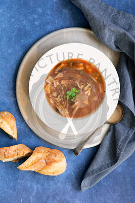 Bowl of Minestrone soup and crusty bread.