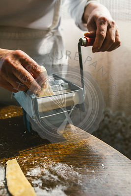 A woman making homemade pastain the traditional way