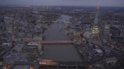 Aerial footage following the River Thames through Central London at night