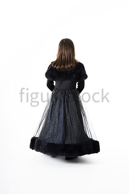A Figurestock image of a little girl dressed as a princess, from Behind – shot from eye level.