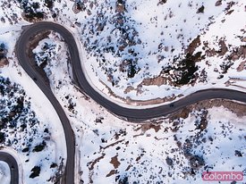 Aerial overhead view of winding mountain road