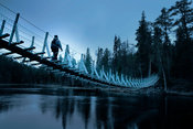 Hiker on suspended bridge