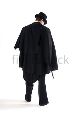 A Figurestock image of a Victorian man in a cloak, holding a knife - shot from eye level.