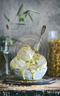 Bowl of pistachio ice cream on kitchen counter, close-up