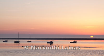 Boats at Meols at sunset