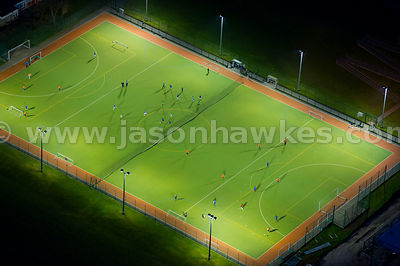 Aerial view of people playing football at night