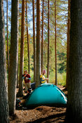 Young couple camping in a forest