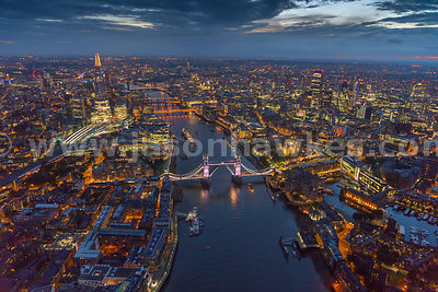 Aerial view of London and Tower Bridge at night.