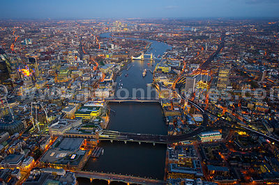 Aerial view over River Thames at night, London