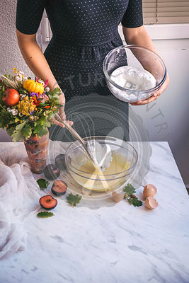 Woman preparing a cake mixture