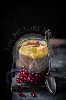 Blended chocolate chia pudding with orange and pomegranate.