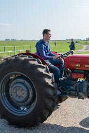 Katwoude, Netherlands - 2018-09-02: Second Oltimer Tractor Tour, Katwoude - Waterland. Participants of the oldtimer tractor tour on their tractor as they start the tour in Katwoude