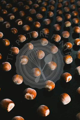 Forest hazelnuts on a black background