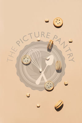 Round walnut cookies on a caramel coloured background.
