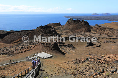 Looking over the walkway and volcanic spatter cones of Bartolome Island to Santa Cruz in the distance (left) and the lava flows of Santiago (right), Galapagos Islands
