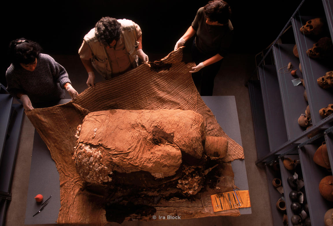 Ira Block Photography unwrapping a mummy bundle