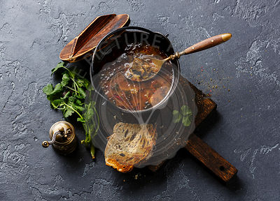 Traditional Georgian soup Kharcho with meat and rice on dark background