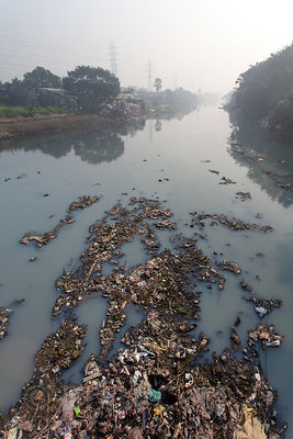 Trash fills a creek near Dhapa, Kolkata, India. Dhapa is the site of Kolkata's largest landfill, and numerous recycling and incineration operations.