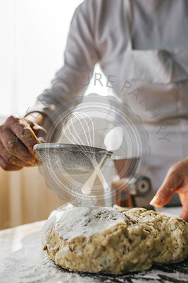 Woman Preparing Homemade Dough in the Kitchen and using a mincing machine. Preparation Raw Dough for Baking