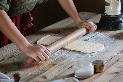Close-up of woman preparing dough