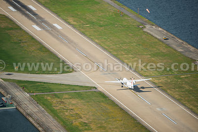 Aerial view of plane taking off at City Airport, London