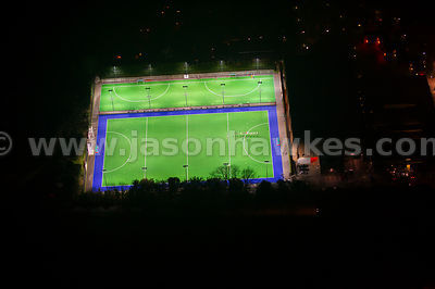 Aerial view of illuminated hockey pitches at night