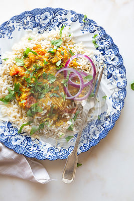 Indian vegan dinner - dal, rice and onion.