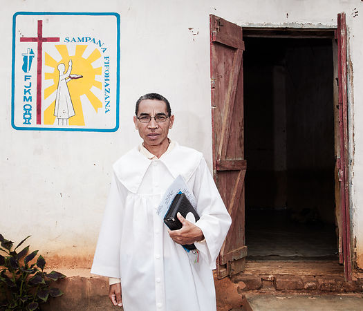 MAHATSINJO - Mr Samson, married, 3 children, is pastor of the Protestant FJKM church at Toby Karmela. A "toby" (which can be translated as "camp") is a kind of dispensary run by "Mpiandry" (healer-exorcist) and which welcomes all sick people in need of care. I note that the majority of patients suffer from psychological disorders (depression, dementia, neurosis, psychosis, etc.). But here they are considered possessed by the devil or an evil spirit. Two or three times a week, at nightfall, the mpiandry of the Karmela toby gather the patients in the prayer room and, in the light of a small bulb, they proceed to a collective exorcism session. The patients pass in turn in front of a mpiandry, who pronounce incantations and prayers, a bible in his hand, to cast out evil eye, evil spirits, demons, or simply to psychologically prepare a fragile person not to be invaded by evil spirits. These sessions last between two and three hours. The mpiandry focus a lot on certain people, like this 13 year old girl, considered as affected by a particularly "tough" demon. They are two mpiandry "working" on her for over an hour. The strident screams of the young girl, in a state of insanity and at the end of nerve, mix with the aggressive psalmodies of the mpiandry plunging the rest of the audience into a form of collective trans.