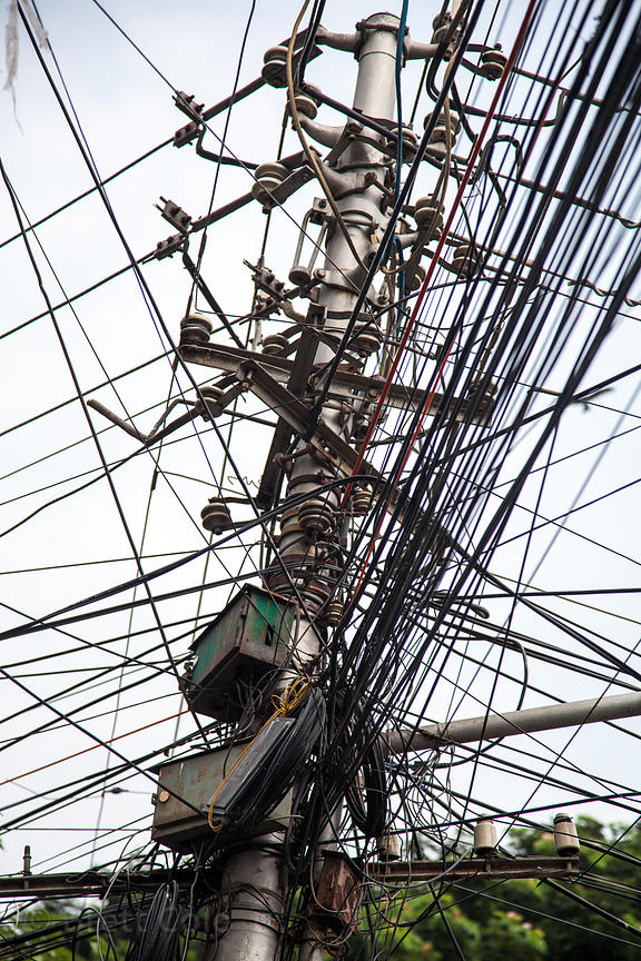 Brett Cole Photography A jumble of electrical wires on a utility pole