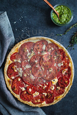 Tomato tart on blue background