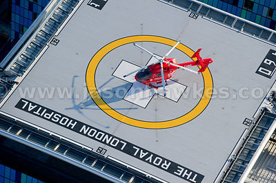 Aerial view of rooftop helipad and helicopter