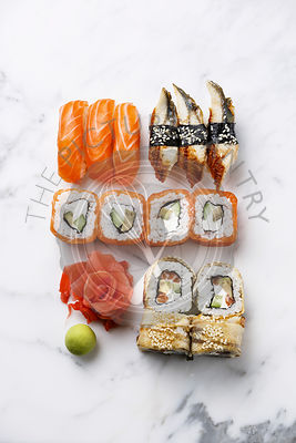 Sushi Set nigiri and sushi rolls on white marble background